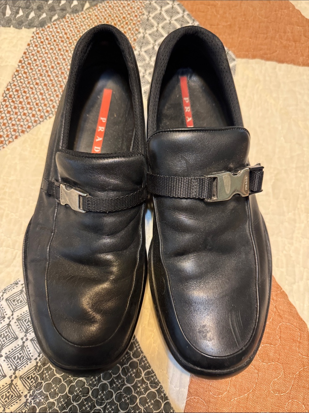 Prada Black Leather Slip-On Loafers with Silver Buckle